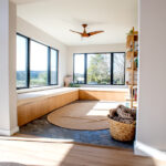 archway to living room with large windows