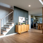 foyer leading to kitchen and staircase in home after a renovation