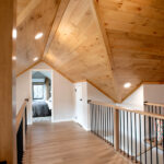 hallway to bonus room with wood ceiling