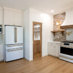 fridge, microwave, and stove in a new kitchen