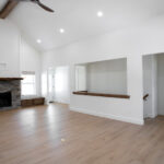 living room with gas fireplace and ceiling fan