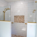 walk in shower with stone details