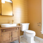 bathroom with gold walls