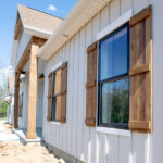 new windows with wooden shutters