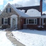 home before a renovation covered in snow