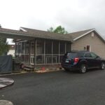 home before addition and siding renovation
