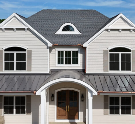 metal porch roof, shingle roof, and multiple windows for new home