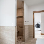 bathroom leading to laundry room