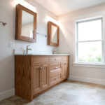 double sink with brown cabinets in new bathroom
