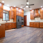 large new kitchen with wooden cabinets