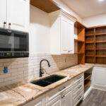 pantry with sink and microwave