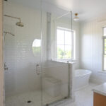 walk in shower and tub in bathroom