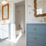 bathroom with two sinks, one white, one blue