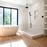 bathroom with large tub and walk in shower
