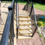 deck stairs with black railings
