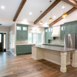 kitchen with island and green cabinets