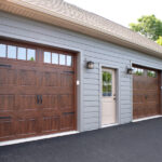 three garage doors with transom glass