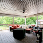 red outdoor couches on a porch