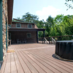 green entrance door to deck with firepit