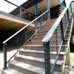 stairs to back deck with cable railings and step lights