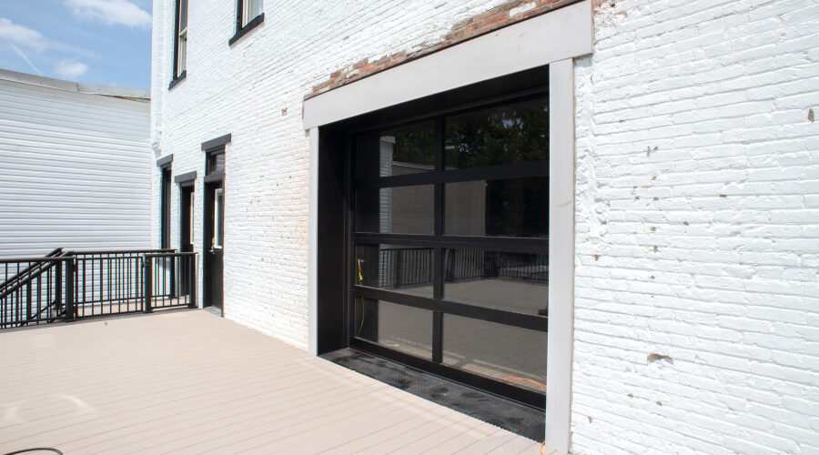 new garage door with black frames and glass