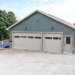 two garage doors for the driveway of a new home