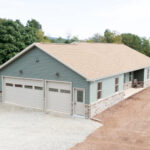 exterior of a new home with green siding