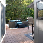 entrance to renovated deck leading to outdoor sitting area and outdoor bar