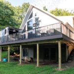 renovated deck with kona flooring and black railings