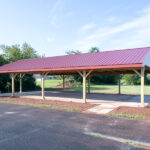 pavilion with red roof and white sidewalls