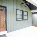 new front porch with new siding and front door