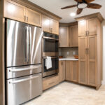 fridge and oven area in remodeled kitchen