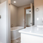 bathroom with tub, shower, and sink