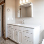 primary bathroom with large sink and medicine cabinet